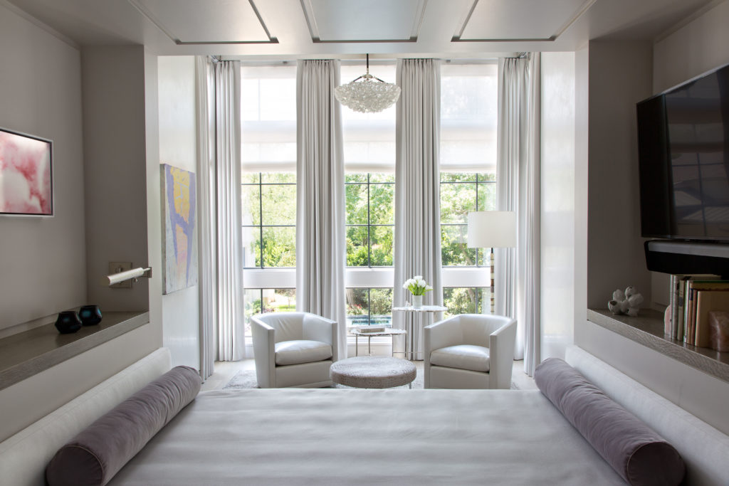 The bedroom in the guest house features a built-in bed, designed by Paul Duesing and Joseph Minton, divides the room. (Photo by Emily Minton Redfield)