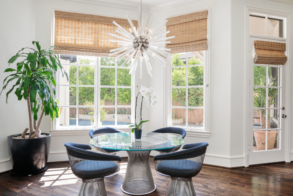 A breakfast area has great views of the outdoor oasis. 