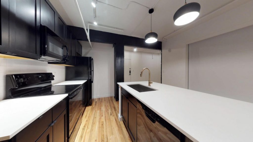 Gloss black appliances are in every unit.