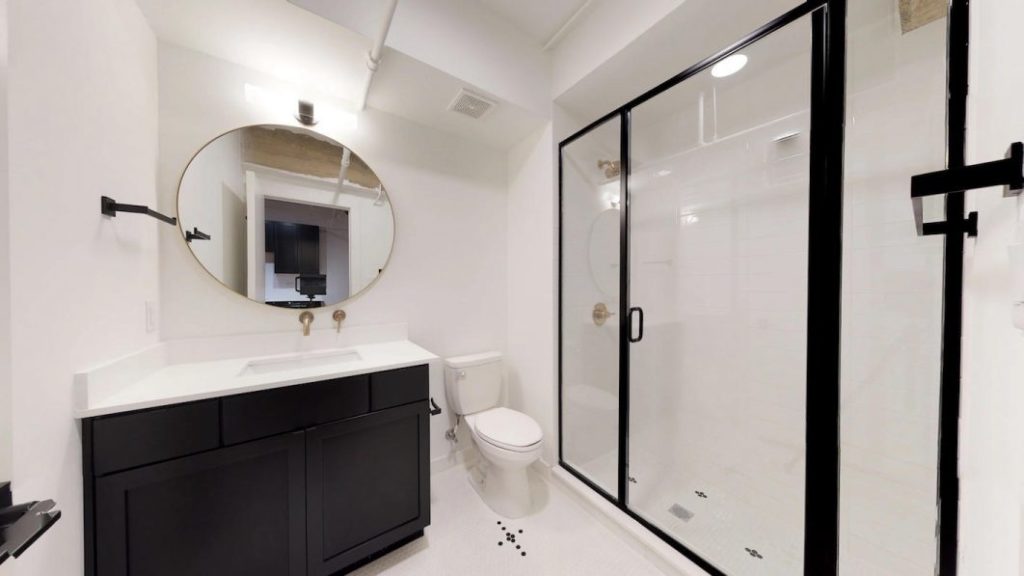 Bathroom have custom-tiled floors.