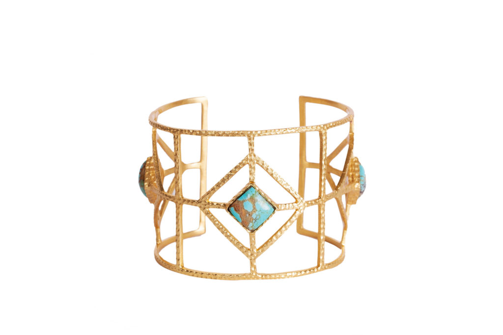 The Lux cuff in turquoise, priced at $245, is constructed of 18k gold-plating over hypoallergenic and nickel-free brass. (Photo by Kristen Eide)