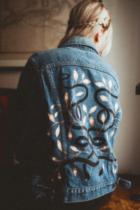 Lynn wearing one of her hand-painted jackets (Photo by Christina Childress)