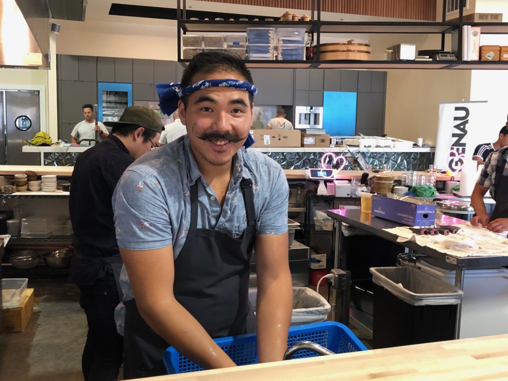 Kokoro chef Daniel Lee, formerly of Uchi, works in his food stall at Bravery Chef Hall. (Photo by Shelby Hodge)