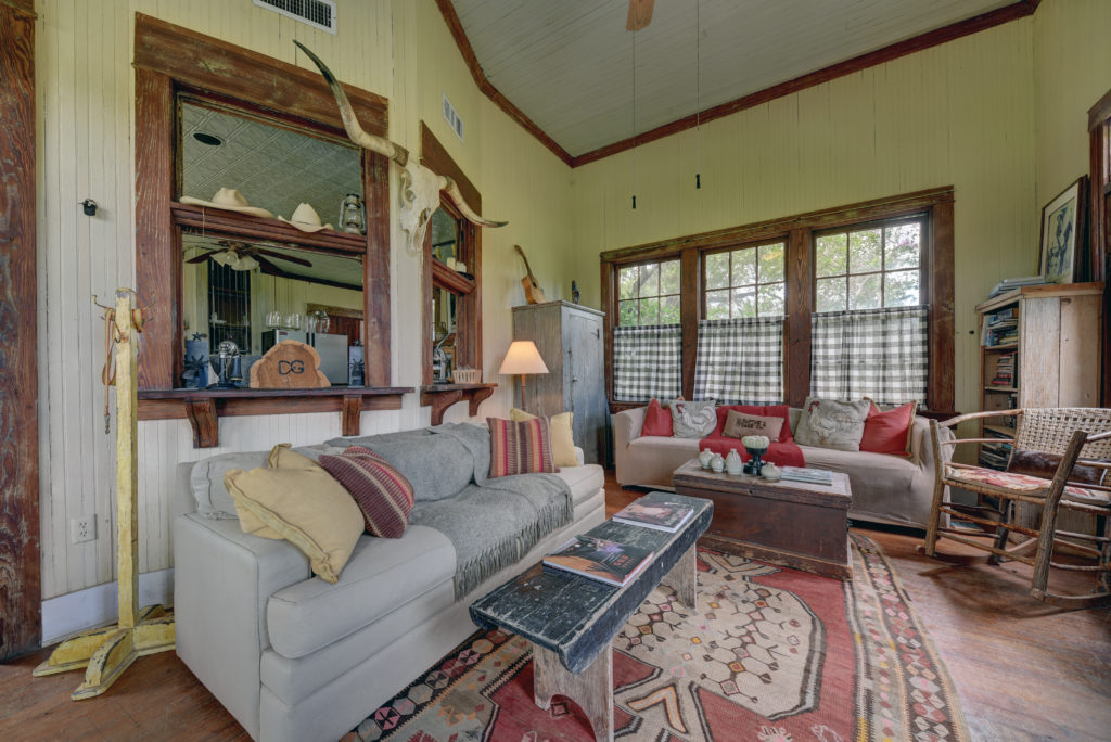 The main house living room opens through 'windows' to the kitchen. (Photo by John Deans, Deans Imaging)