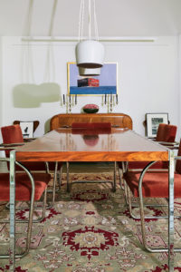 In the dining room, finds from the much-missed Houston mid-century dealer Metro Modern hold court: rosewood-and-chrome table/desk, part of Richard Schultz’s desk collection originally designed for Knoll in 1963, rimmed by Brno chairs originally designed by Ludwig Mies van der Rohe and Lilly Reich in 1929-1930. (This particular set, manufactured in 1981, is covered in the original rust-red mohair). Sculptural AIM ceiling light designed by the Bouroullec Brothers for Flos, 2013. Galveston artist Leslie Sanders’s maritime painting “Outbound,” 2014. (Photo by Pär Bengtsson) (Photo by Pär Bengtsson)