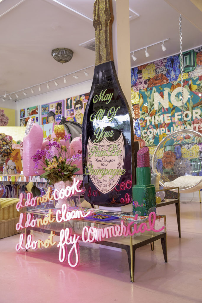 Longshore's bottle of Veuve is her calling card, and here it sits behind a piece that states, "I Do Not Cook, I Do Not Clean, I Do Not Fly Commercial," which is also the name of her upcoming coffee table tome published by Rizzoli.