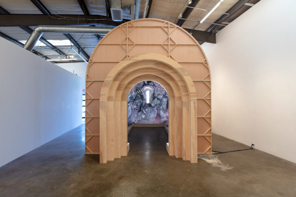 The piece consists of a wooden archway and murals. Courtesy of Erin Cluley Gallery