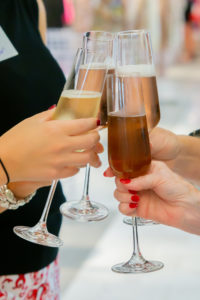 Clinking glasses for girls night out at Neimans. (Photo by Laura McCarthy/Elusive Images)