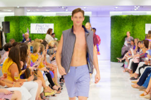 Dylan decided to mix things up, sans shirt, to end the purple chapter of the runway show. (Photo by Laura McCarthy/Elusive Images)