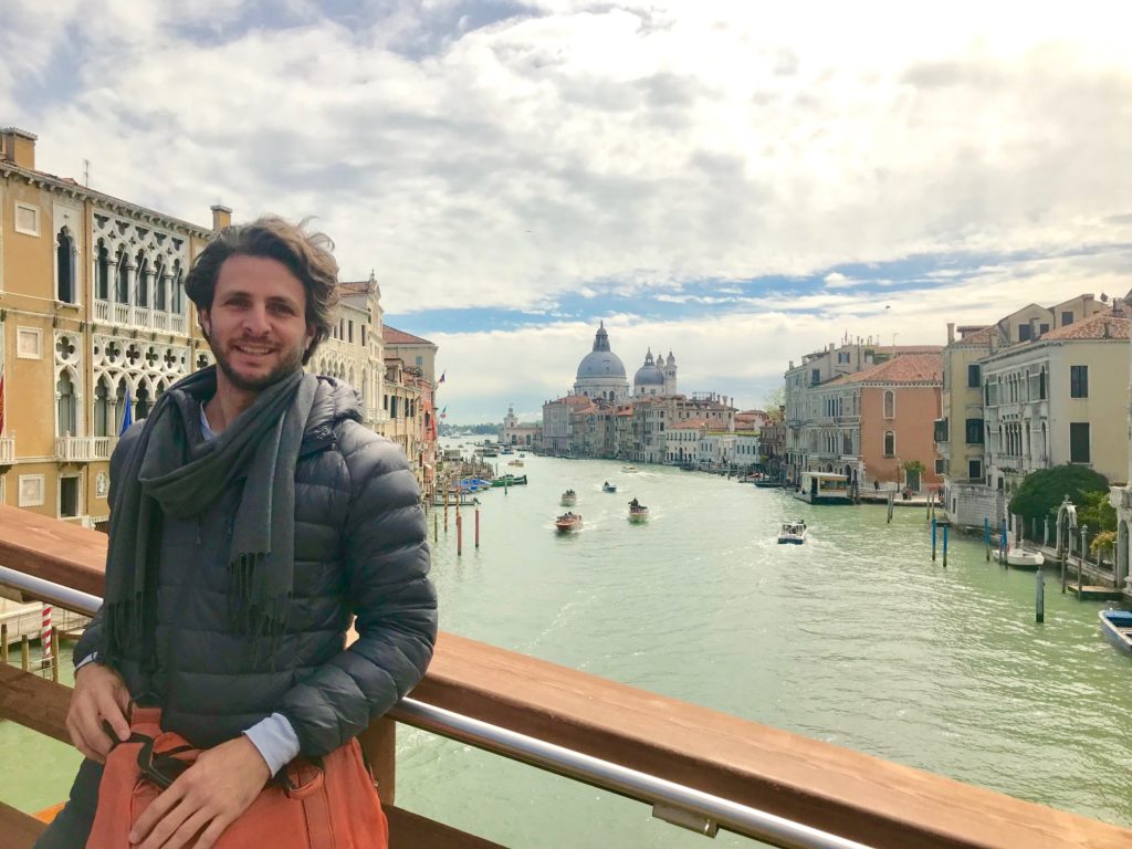 Texas artist Justin Garcia on the Grand Canal, as Basilica di Santa Maria della Salute looks on. (Photo courtesy the artist) 