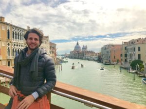 Texas artist Justin Garcia on the Grand Canal, as Basilica di Santa Maria della Salute looks on. (Photo courtesy the artist)