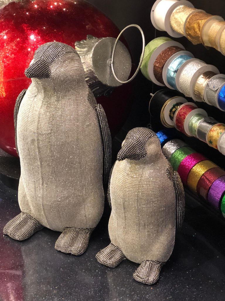 The larger-than-life adorable penguins deliver a glittering note to a holiday decorative theme. (Photo by Shelby Hodge)