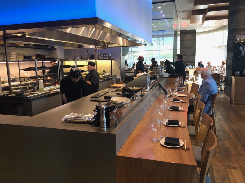 Roka Reserve guests are seated at a special table with a front row view of the grilling in the Roka Akor kitchen.