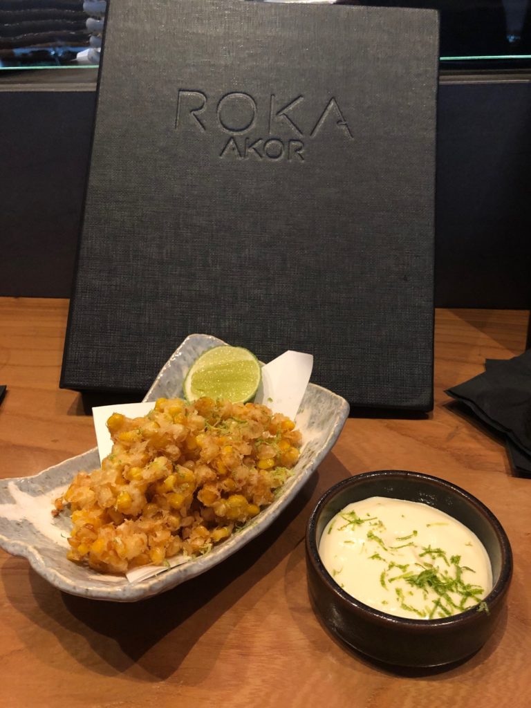 Sweet corn fritters are tastiest enough for dessert and a crunchy foil to the chicken meatball served in the same course.