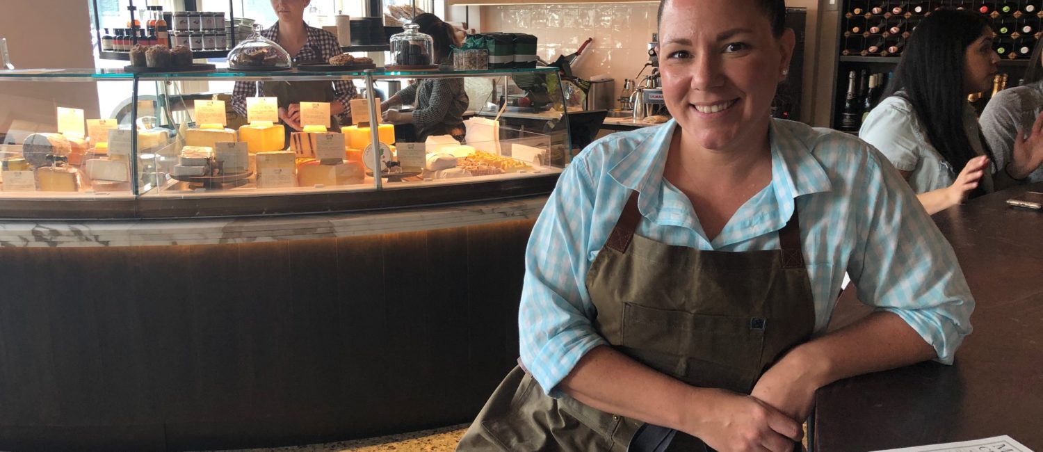 Montrose Cheese & Wine GM and cheese monger Shannon McCracken oversees the seasonally-changing selection of a dozen or more cheeses. (Photo by Shelby Hodge)