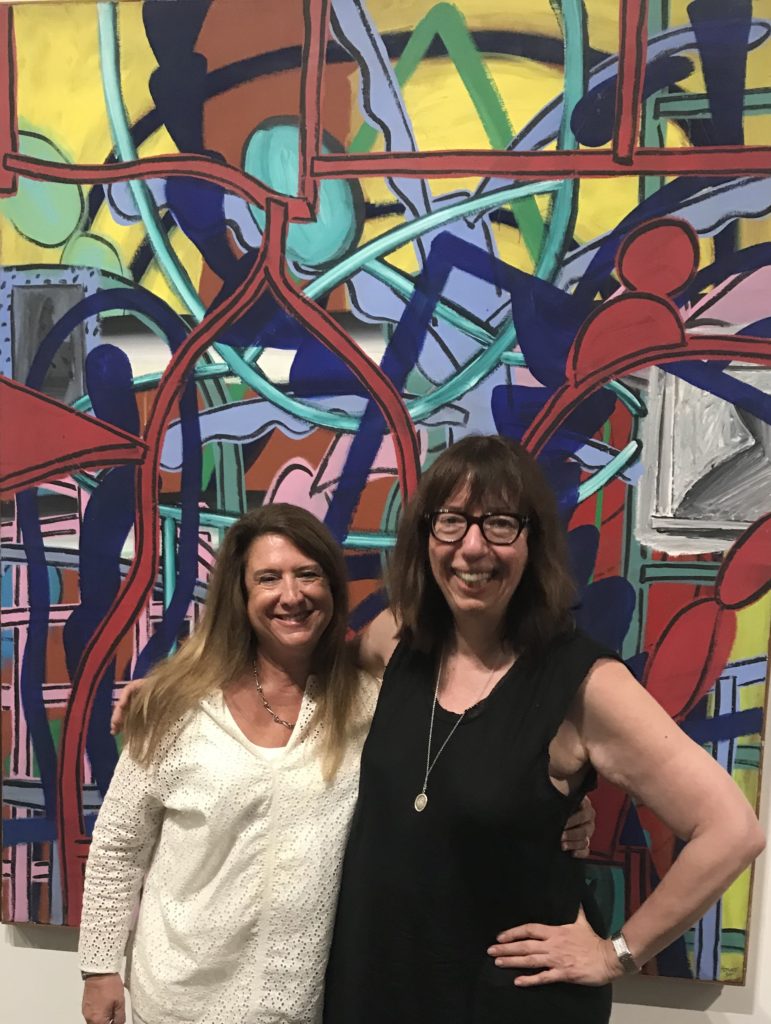 Gallerist Deborah Colton, MFAH curator Alison de Lima Greene at the Perry House Tribute Exhibition, August 2019. In the background, House's "Untitled" canvas from 1984. The late Houston painter was one of the stars of "Fresh Paint: The Houston School," a traveling exhibition that debuted at the MFAH in 1985. (Photo courtesy Deborah Colton Gallery)