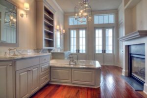 Architect Steve Mouzon designed the Galveston Beachtown home with a master bath complete with hardwood floors, a gas fireplace and doors opening to a gallery overlooking the Gulf.