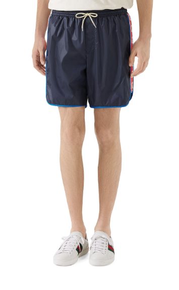 Gucci logo-stripe swim trunks, available at neimanmarcus.com, $680.
