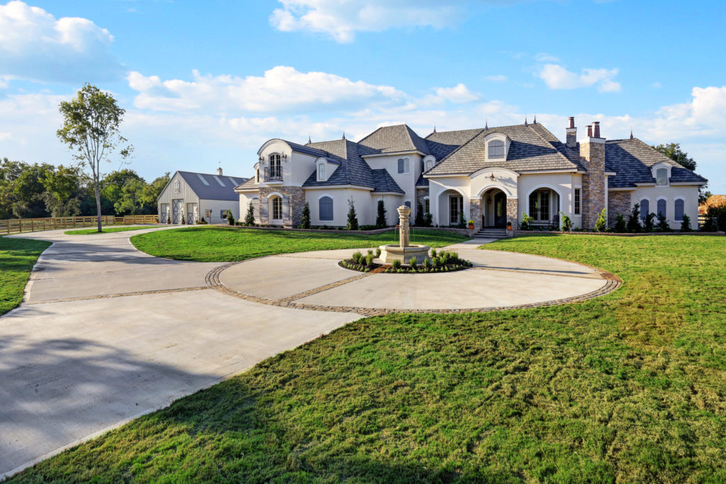 This massive custom home, complete with horse barn, was one of the first built in the Willowcreek Ranch community near Tomball. 