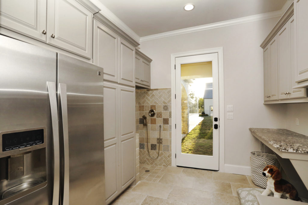 The dog wash and mud room combine as a story area and includes a second refrigerator.