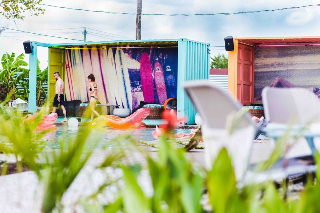 The cabanas are made from industrial shipping containers. 