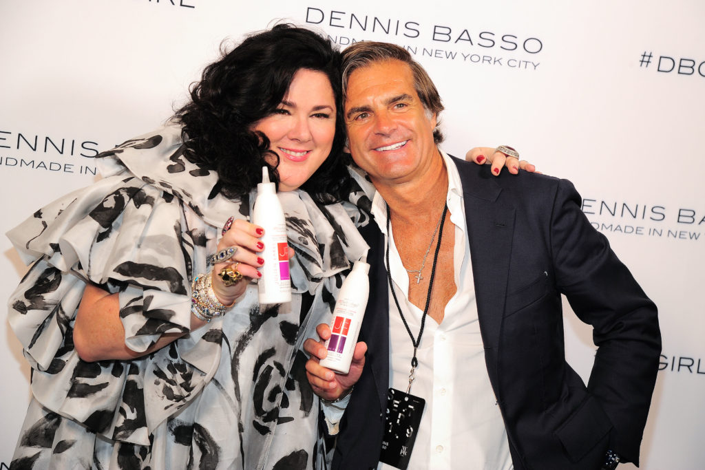 Newly coiffed Ashley Longshore poses backstage with stylist Julien Farel at the Dennis Basso runway show during New York Fashion Week. (Photo by Owen Hoffmann/Patrick McMullan via Getty Images)