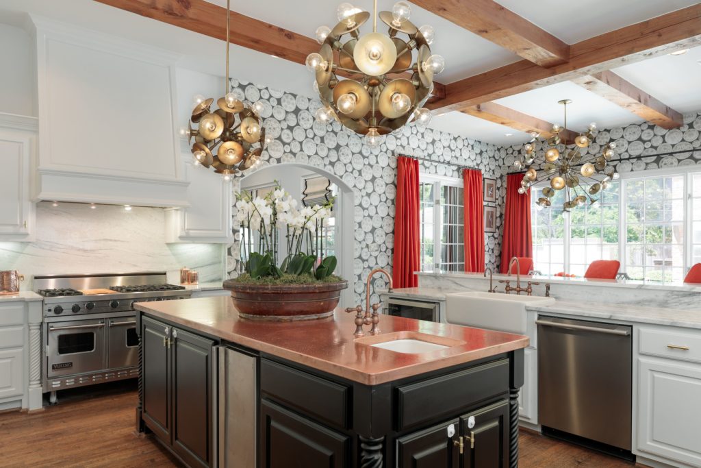 The kitchen is soft with exposed wooden beams. 
