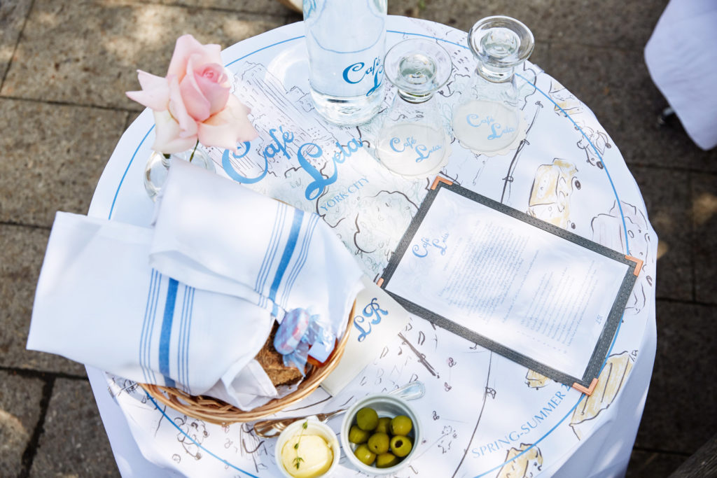 Round tables covered with crisp white tablecloths and laden with baguettes, croissants and other freshly baked breads lined a long sidewalk. (Photo by Taylor Jewell)