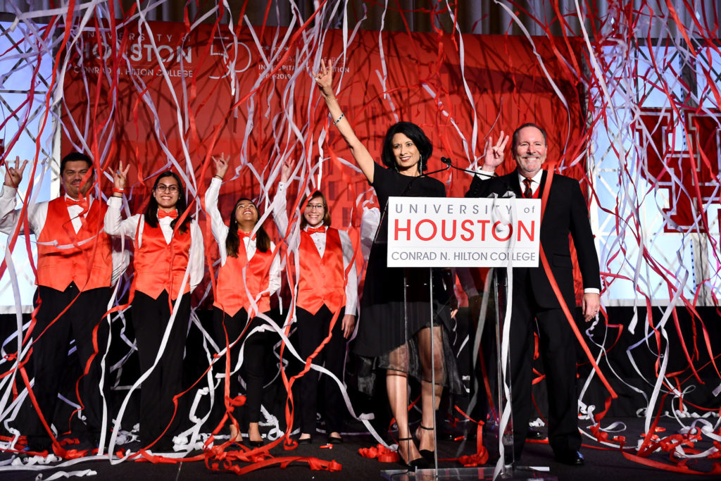 UH System Chancellor and UH President Renu Khator, Hilton College Dean Dennis Reynolds with student scholars from Hilton College