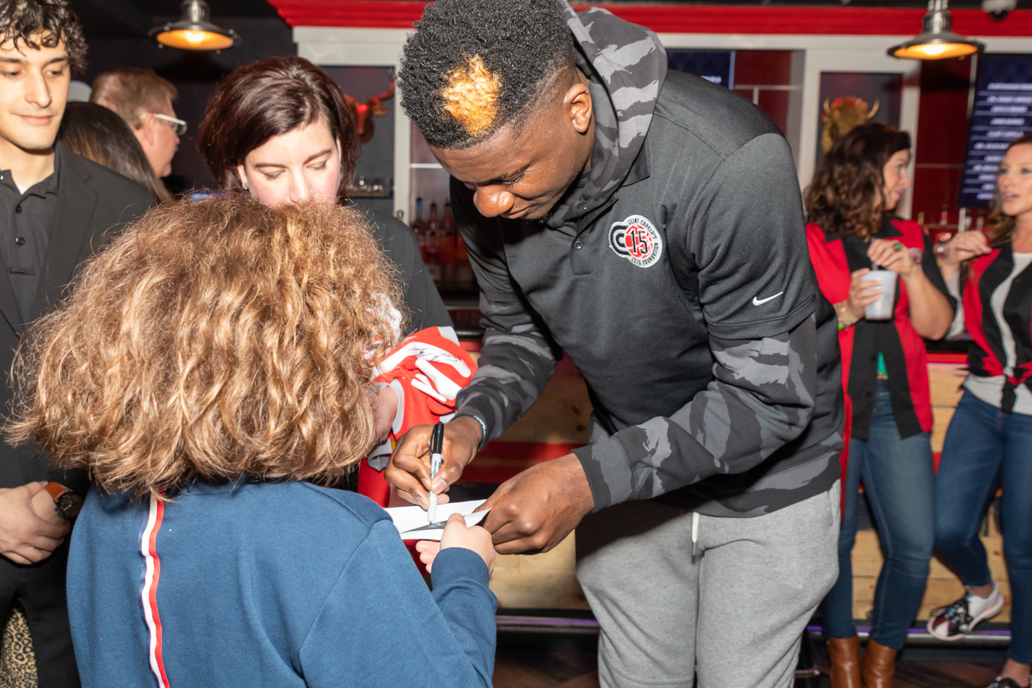 Clint Capela gives out autographs to supporters (Photo by Lee Beckman)