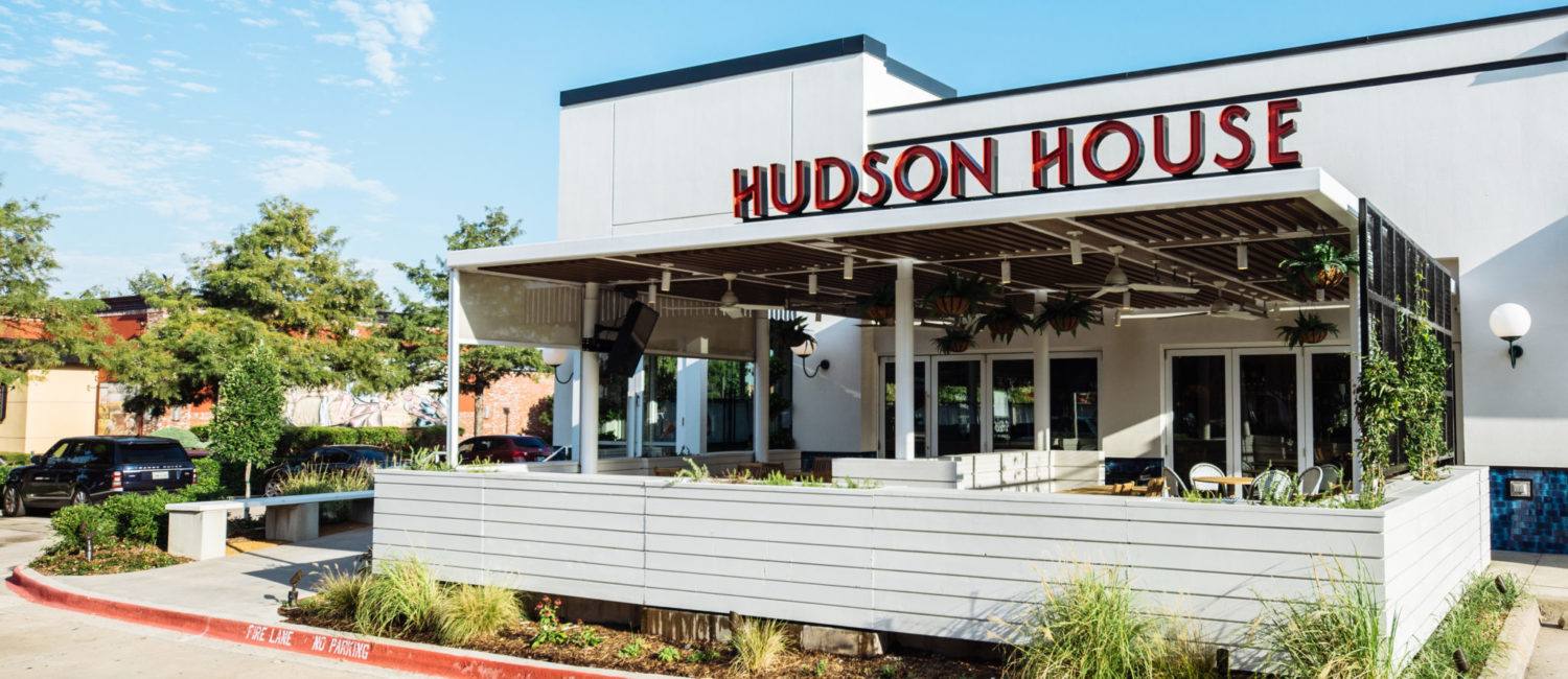 The charming facade to the Hudson House Addison with its lovely patio.