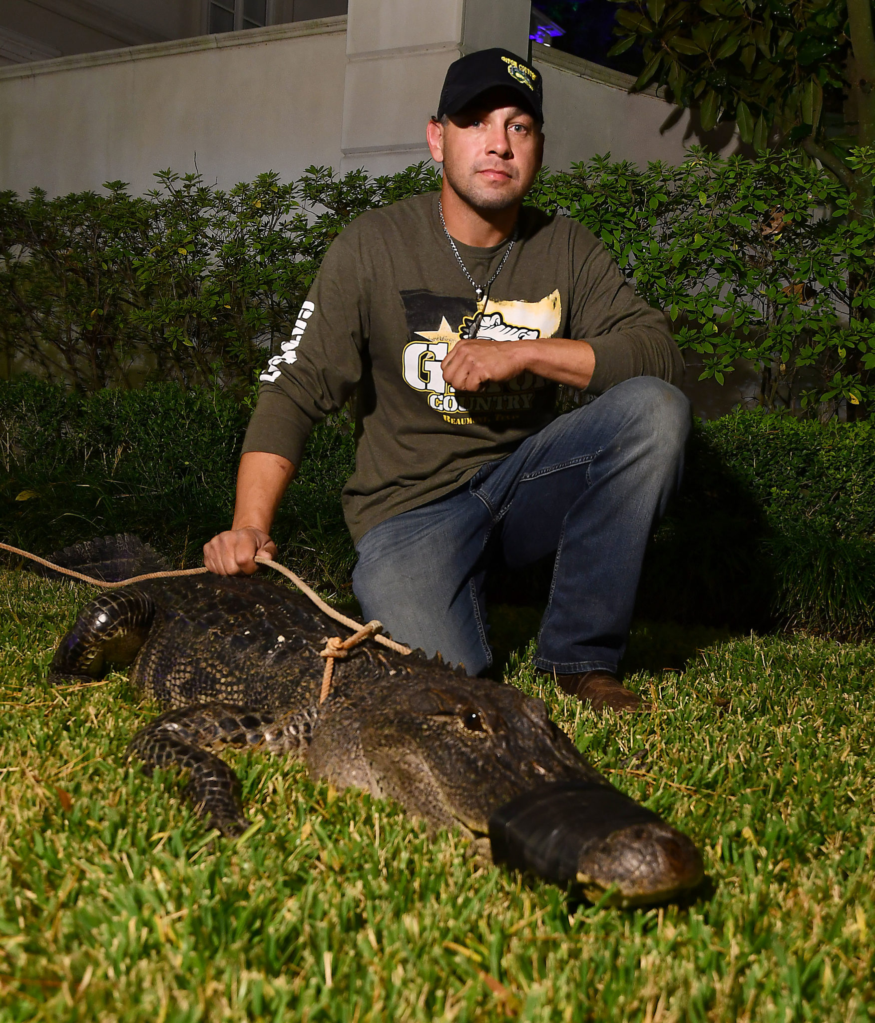 10-foot live Alligator welcome guests at the Houston Police Foundation’s 12th Annual True Blue Gala at the home of Tilman Fertitta Friday