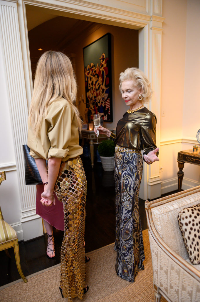 Lynn Wyatt gives a look of approval to Lauren Santo Domingo's stylish ensemble. (Photo by Sarah Austin)