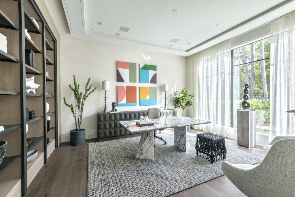 The size of this home office dictated a spectacular work space, here provided by a Cantoni dining table. (Photo by Jeff Myers Photography)