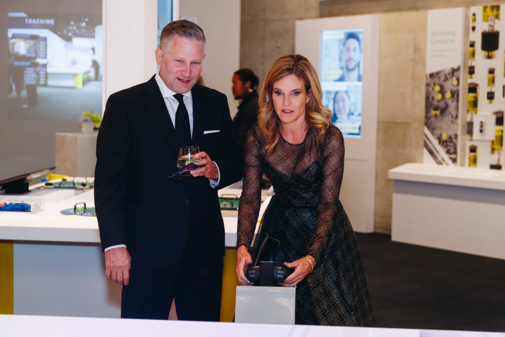 Rob & Jill VanGorden, Perot Museum Vice President of Guest Engagement, try out the robot stations in the reimagined Texas Instruments Engineering and Innovation Hall (Photo by Turk Studio)
