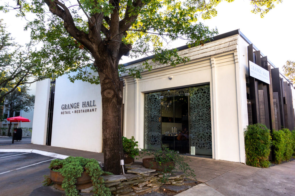 The white facade to Grange Hall which belies the dark and moody space found within.