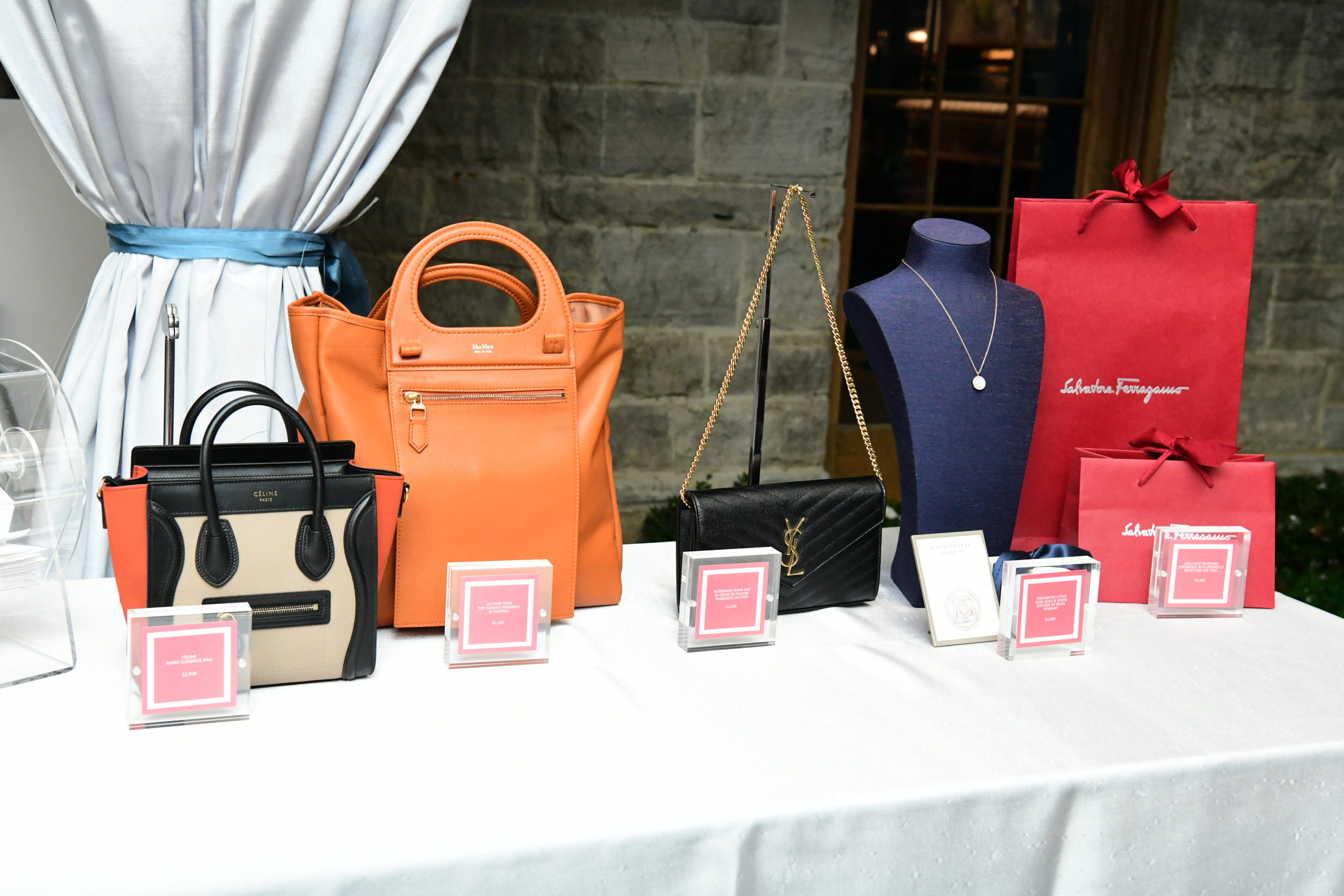 Coveted raffle goodies from presenting underwriter The Galleria's luxury retailers The Webster, Max Mara, Saint Laurent, De Beers, and Ferragamo (Photo by Daniel Ortiz)