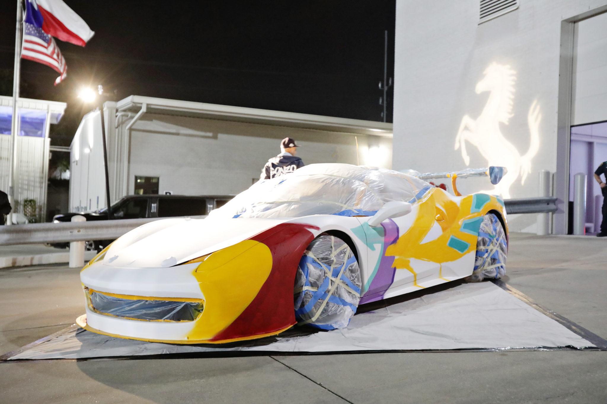 Aerosol artist Gonzo247 paints a special Ferrari for the big reveal.