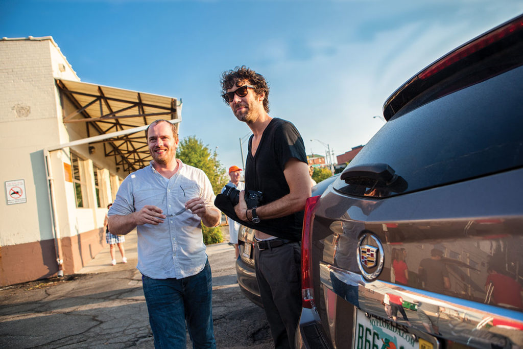 Hesse McGraw with artist Michael Jones McKean, 2012, Omaha, Nebraska. McGraw is known as an artist's advocate who has devoted more than a decade of his career to realizing innovative curatorial endeavors beyond museum walls. (Photo courtesy Omaha Magazine)