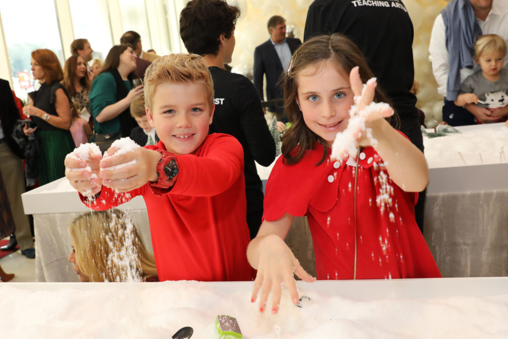 Children playing in the 'snow' (Photo by Priscilla Dickson)