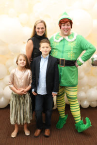 Rachel Regan and her kiddos with Buddy, The Elf (Photo by Priscilla Dickson)