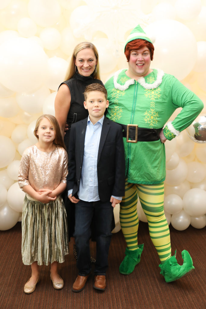 Rachel Regan and her kiddos with Buddy, The Elf (Photo by Priscilla Dickson)