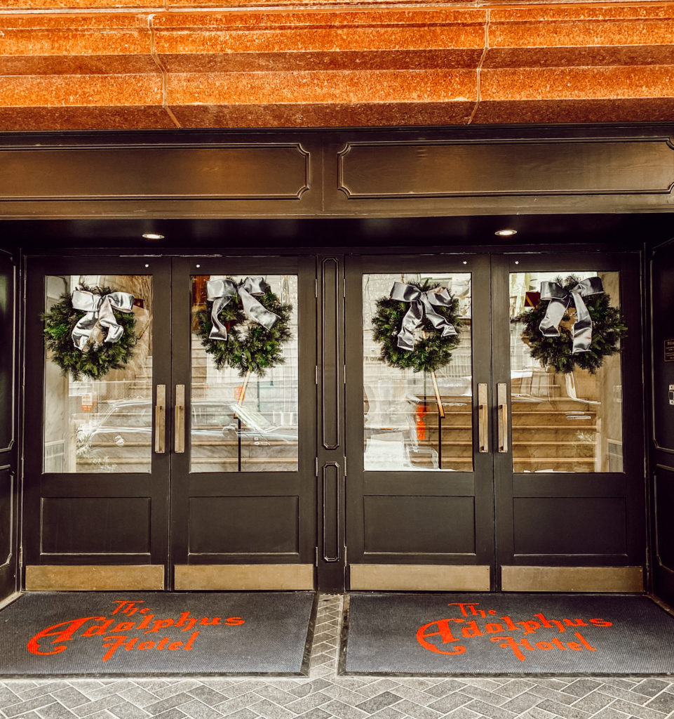 The Adolphus Hotel's doors festooned for the holidays.