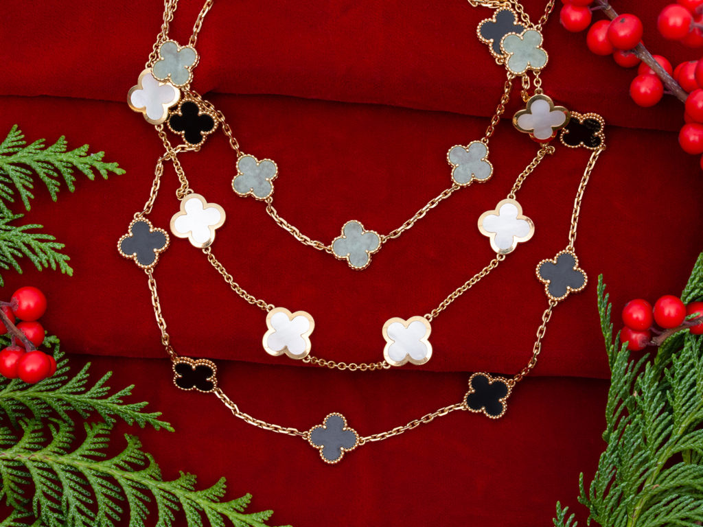 A selection of vintage Van Cleef & Arpels Alhambra necklaces in jade, mother-of-pearl and onyx