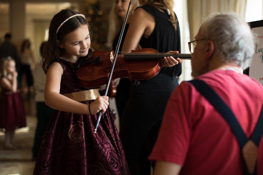 A magical moment on the violin at the Houston Symphony holiday event for families. (Photo by Leah Wilson)