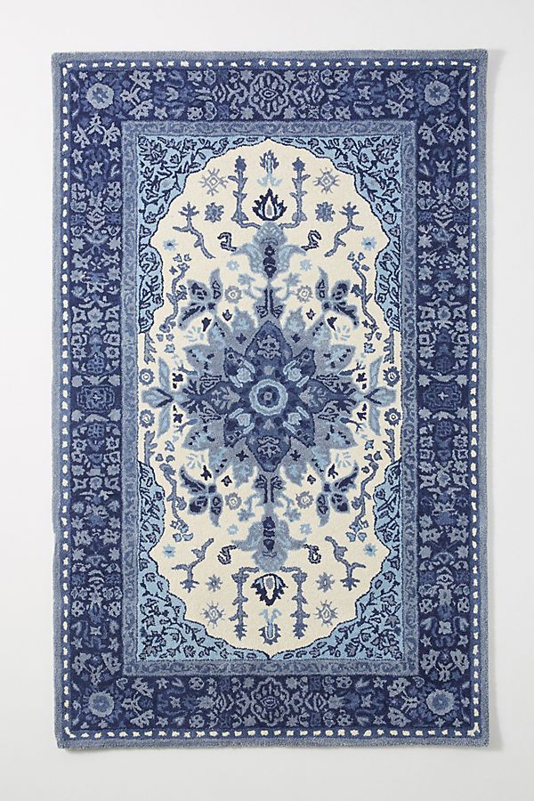 Another way to pull classic blue into your home. 
Hand-tufted Millie Rug in Blue Motif - $998 
Anthropologie.com