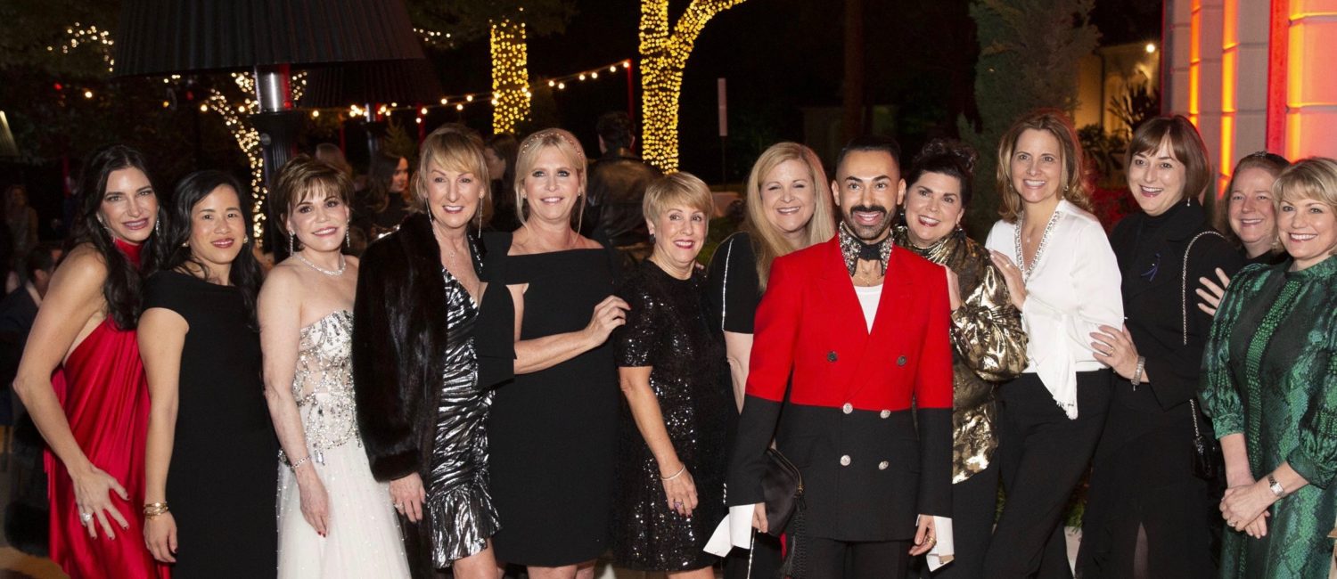 The uber fashionable Fady Armanious, creative director of Tootsies, is surrounded by admirers at the Legacy Community Health cocktail party. (Photo by Jenny Antill Clifton)
