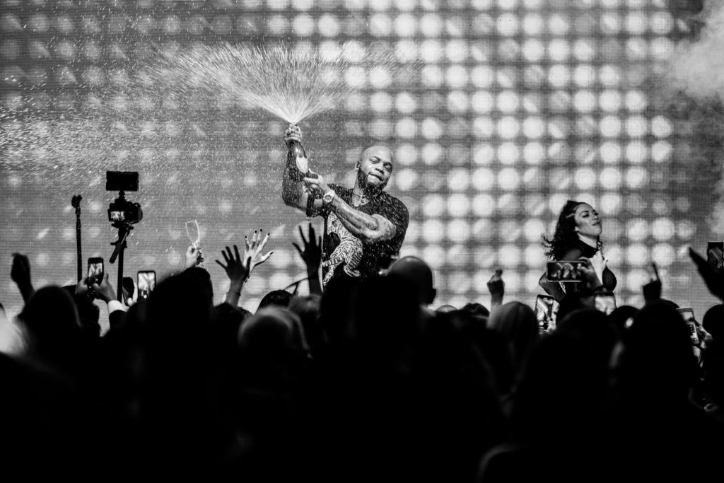 Flo Rida gets the Altus Foundation party started with a Dom Perignon shower (Photo by Composure Studio, Versa Creative)