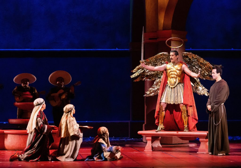 Children, Miguel de Aranda as Chucho, and Rafael Moras as Father Matia. (Photo by Lynn Lane)