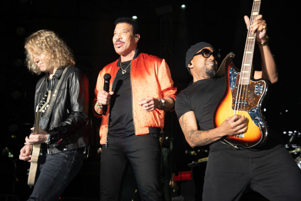 Lionel Richie's band played the saxaphone and harmonica.